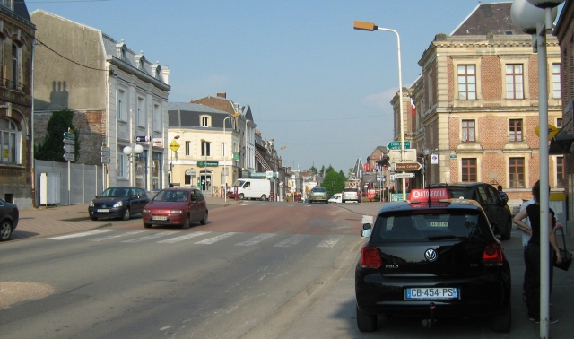 le nouvion-en-thierache town centre, a small french town centre with a few cars and people
